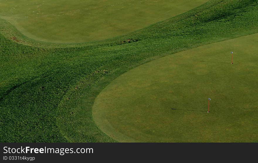 Two tones of green color, putting green practice area, useful picture for desktop wallpaper for golf lovers. Two tones of green color, putting green practice area, useful picture for desktop wallpaper for golf lovers
