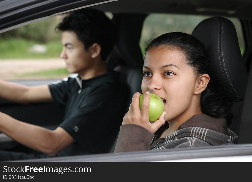 Young English in their brand new car going for a trip. Young English in their brand new car going for a trip