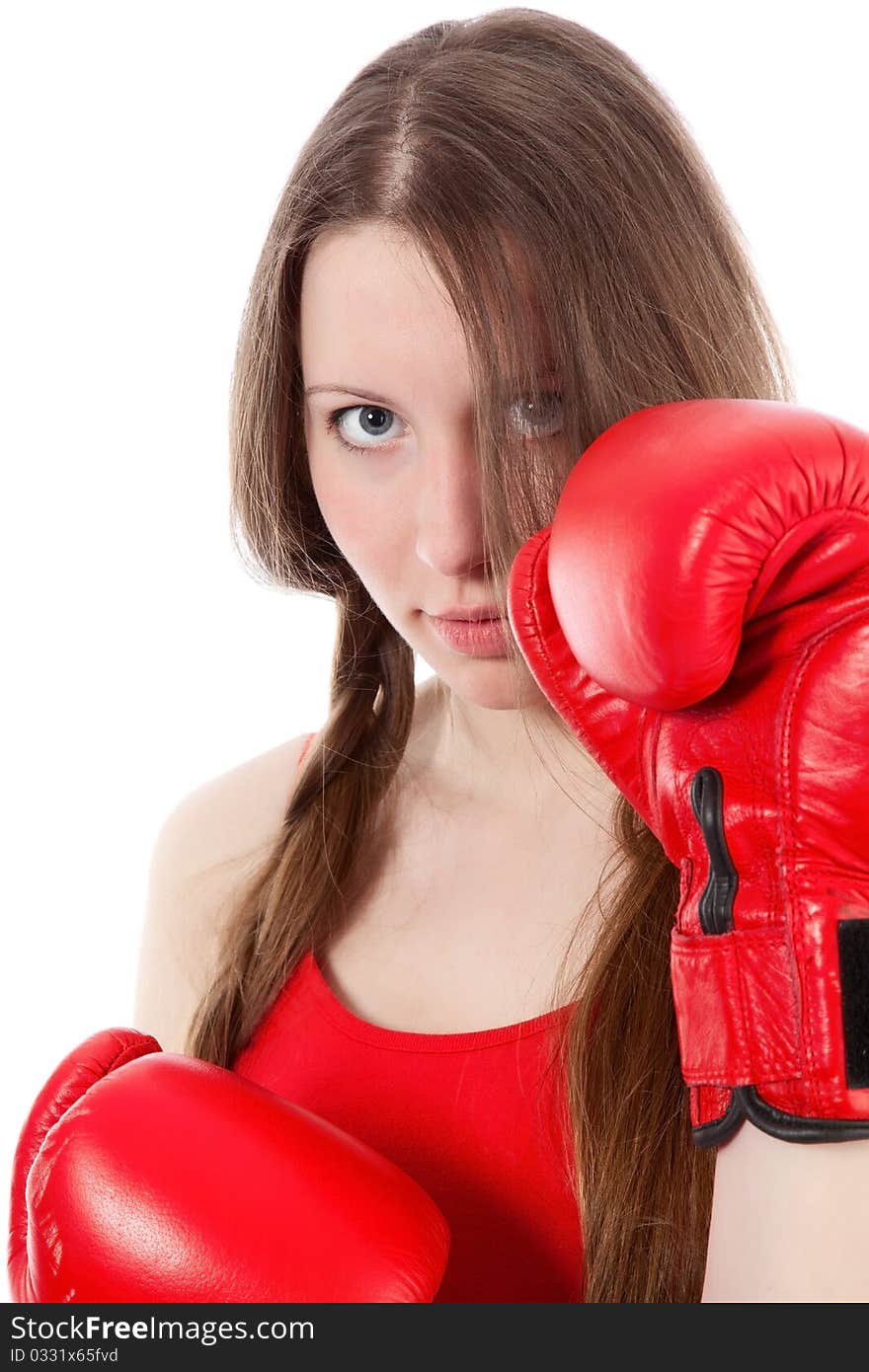 Woman wearing boxing gloves over white background