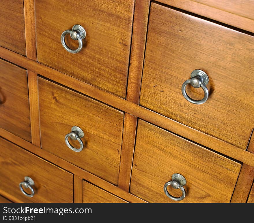 a background of wooden drawers in a chest of drawers