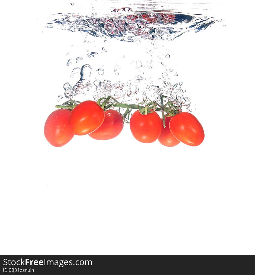 Tomatoes splash on white background