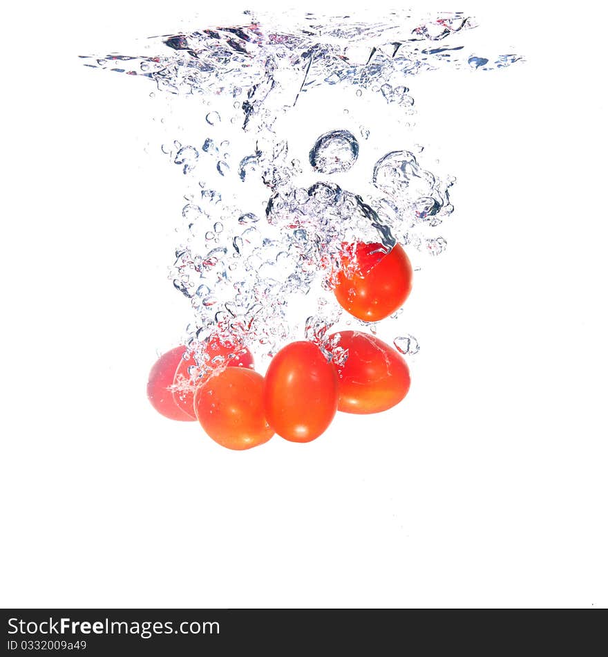 Tomatoes splash on white background