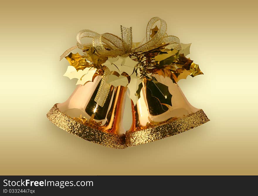 Christmas bells over a golden background. Christmas bells over a golden background