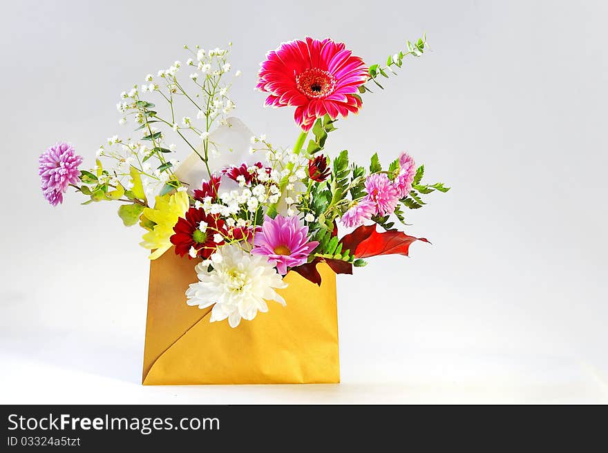 Envelope and flowers details isolated in studio