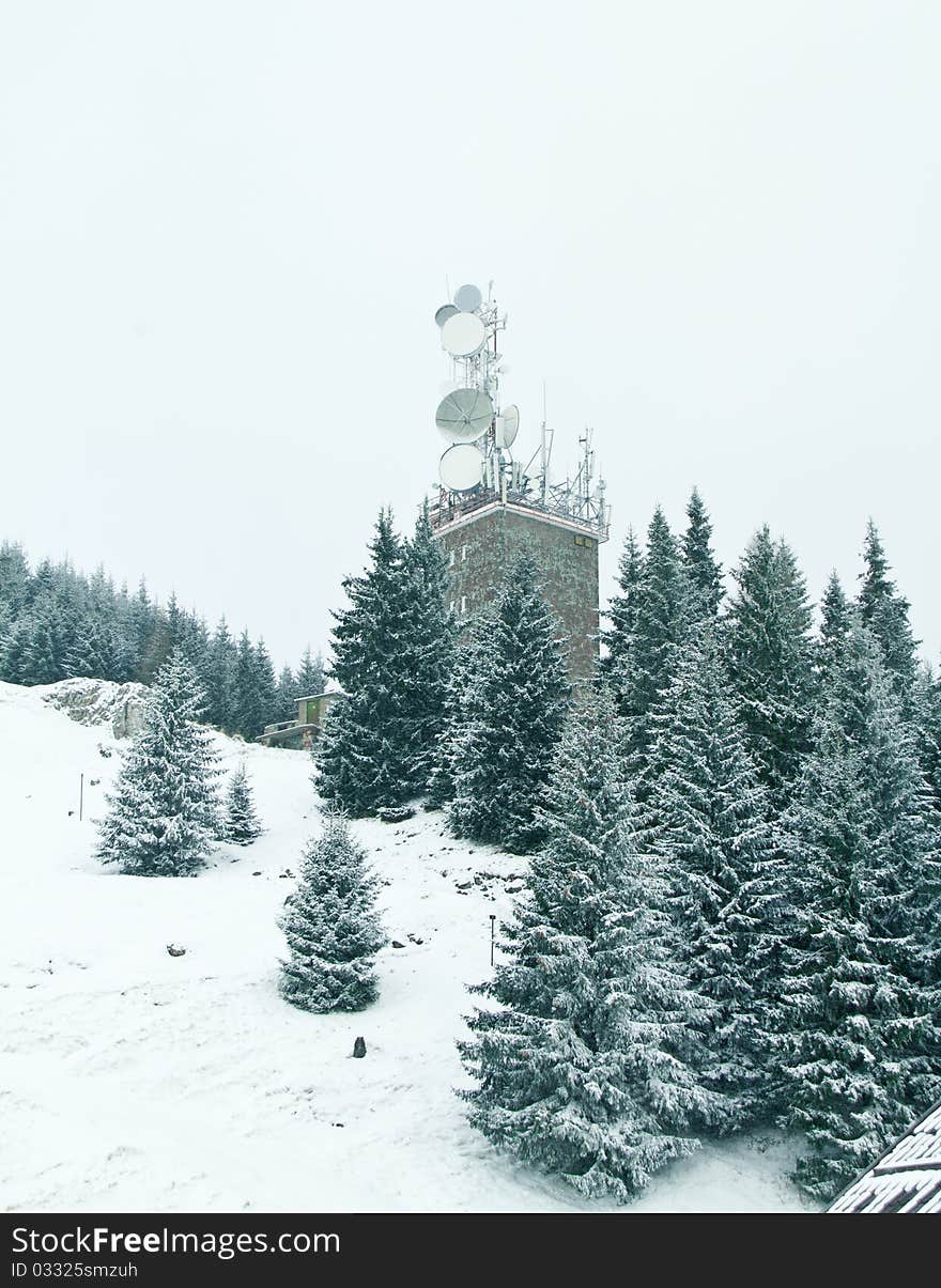 Different types of antennas in the mountains in winter