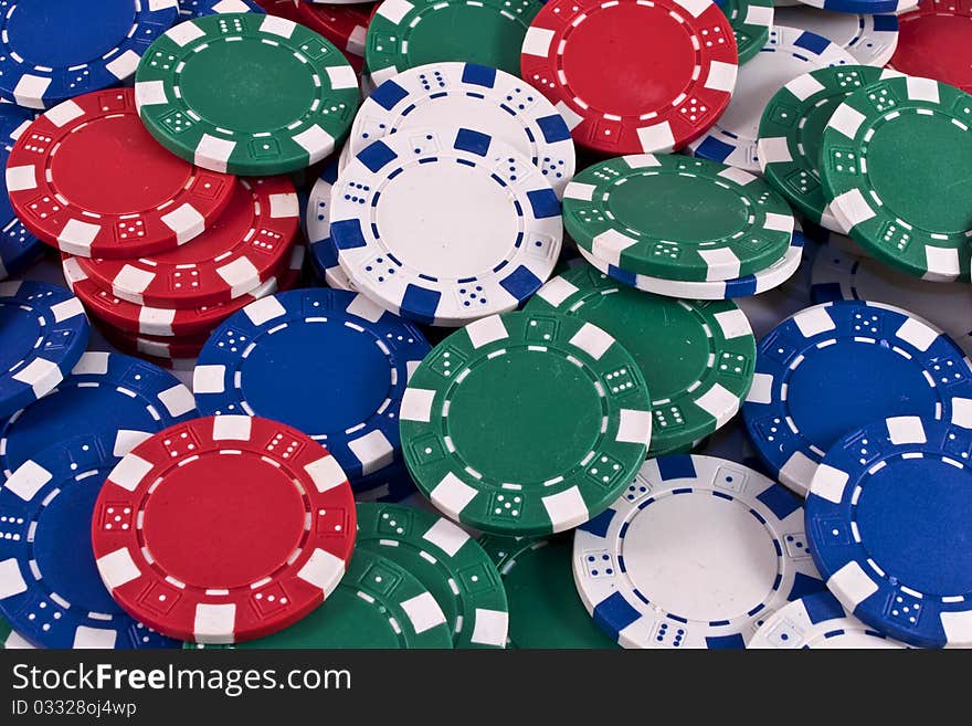 Red, blue, white and green poker chips