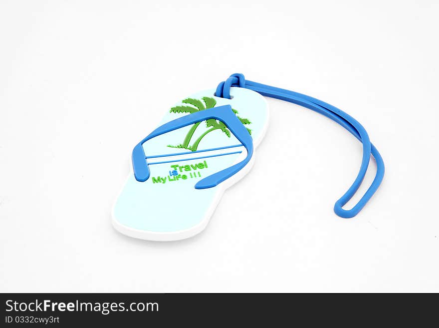 Isolated luggage name tag in sandal shape