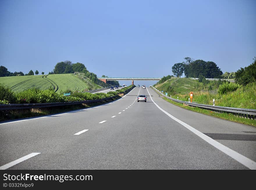 An image of highway during sunny day