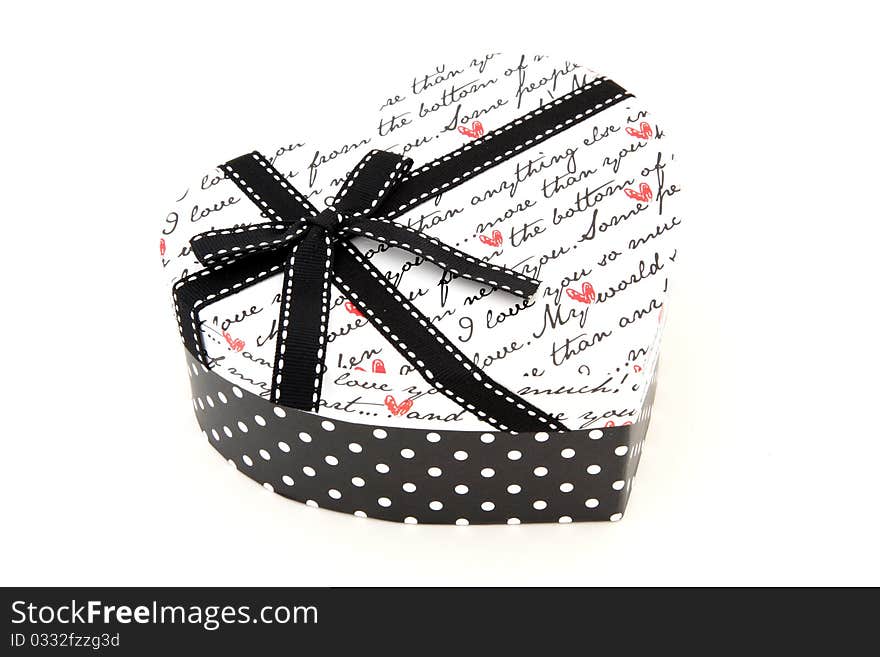 Perspective of isolated black and white holiday gift box in heart shape