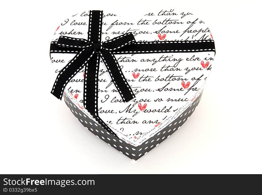 Isolated black and white holiday gift box in heart shape. Isolated black and white holiday gift box in heart shape