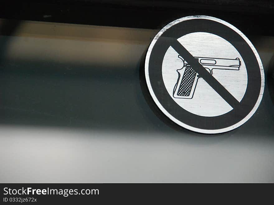 Sign showing a prohibition on weapons in a public space. Sign showing a prohibition on weapons in a public space