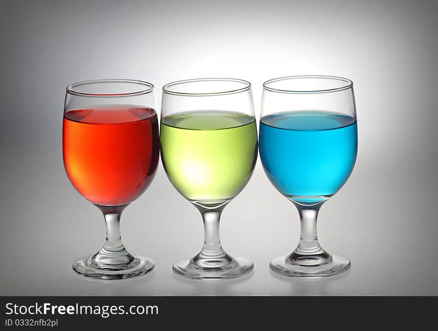 Red, green, and blue liquid in a glass separately. Red, green, and blue liquid in a glass separately