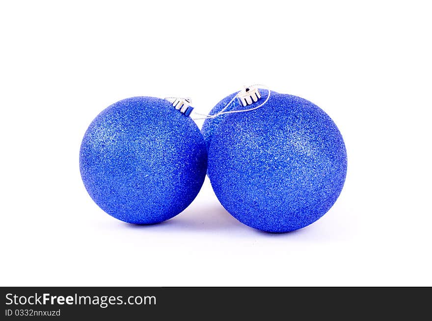 Three blue christmas crystal ball on white background, against a white background. Three blue christmas crystal ball on white background, against a white background