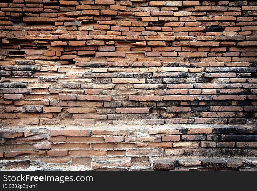 A detailed view of an old red brick wall. A detailed view of an old red brick wall.