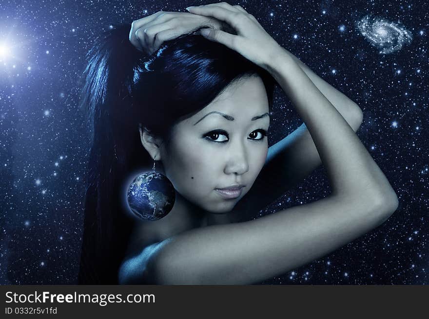 Portrait of cute female fashion model posing on dark background