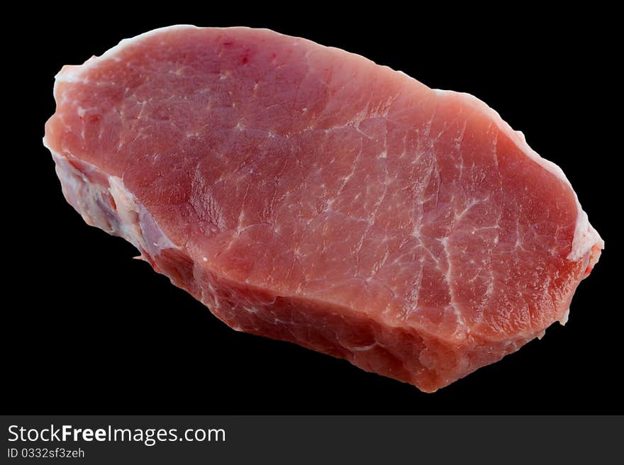 Fresh pork loin chops isolation on a black background closeup