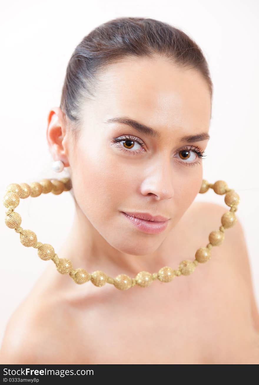 Portrait of the beautiful girl with a groundless beads. Portrait of the beautiful girl with a groundless beads