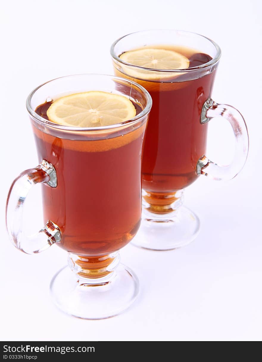 Two glasses of tea with lemon