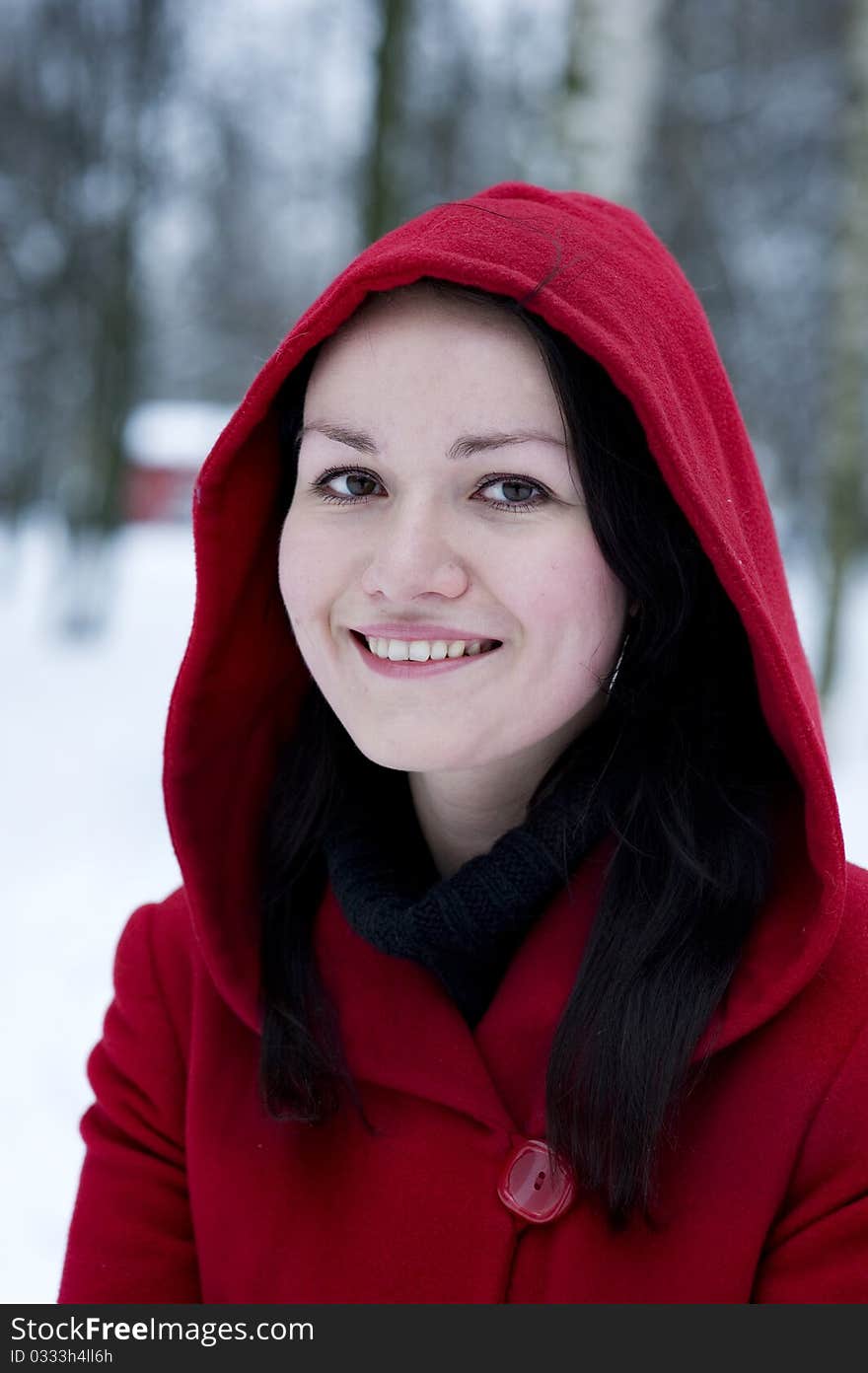 Smiling young pretty girl in the red coat. Smiling young pretty girl in the red coat