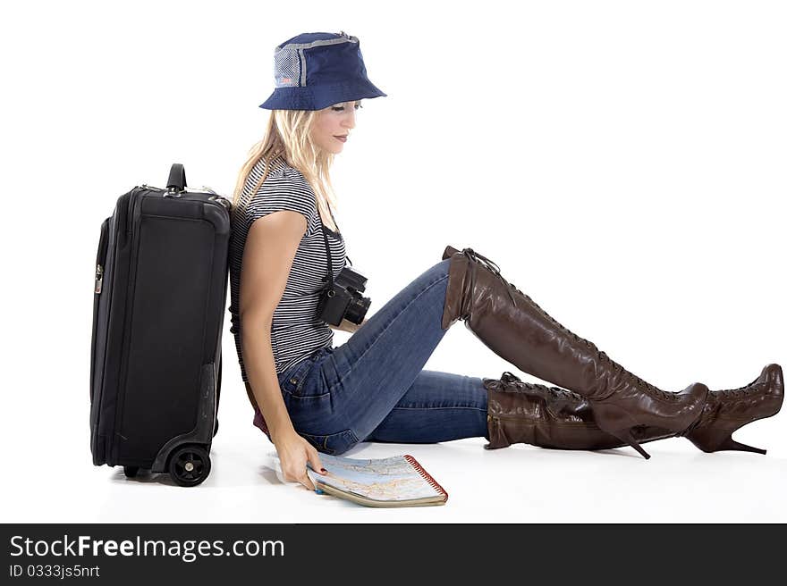 Tourist woman with her suitcase and world map ready to go on a trip. Tourist woman with her suitcase and world map ready to go on a trip