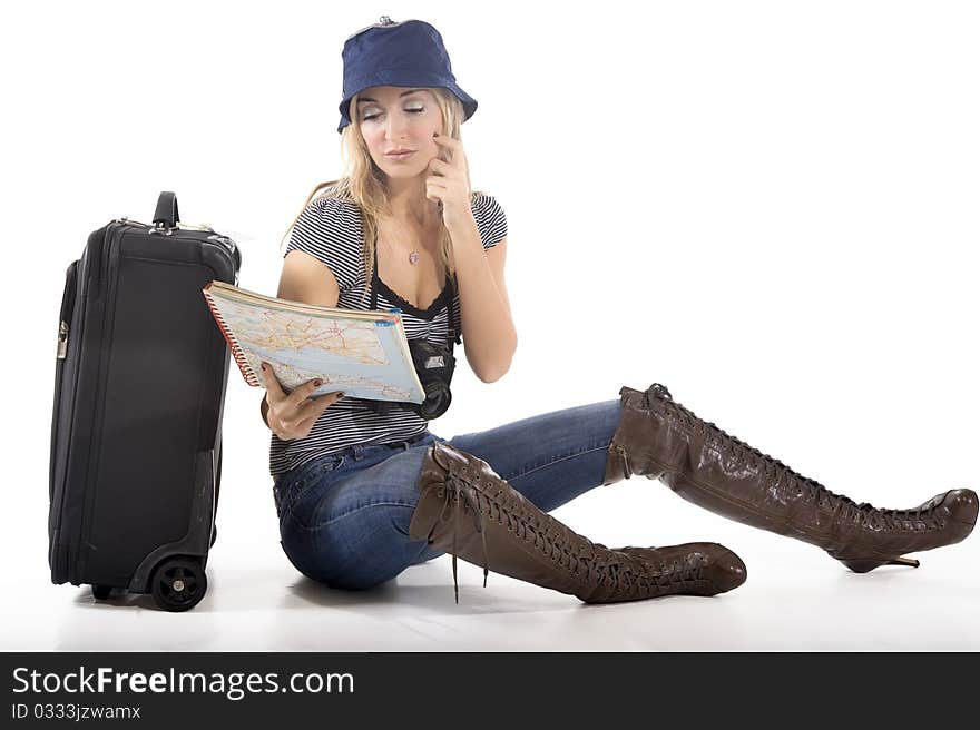 Tourist woman with her suitcase and world map ready to go on a trip. Tourist woman with her suitcase and world map ready to go on a trip