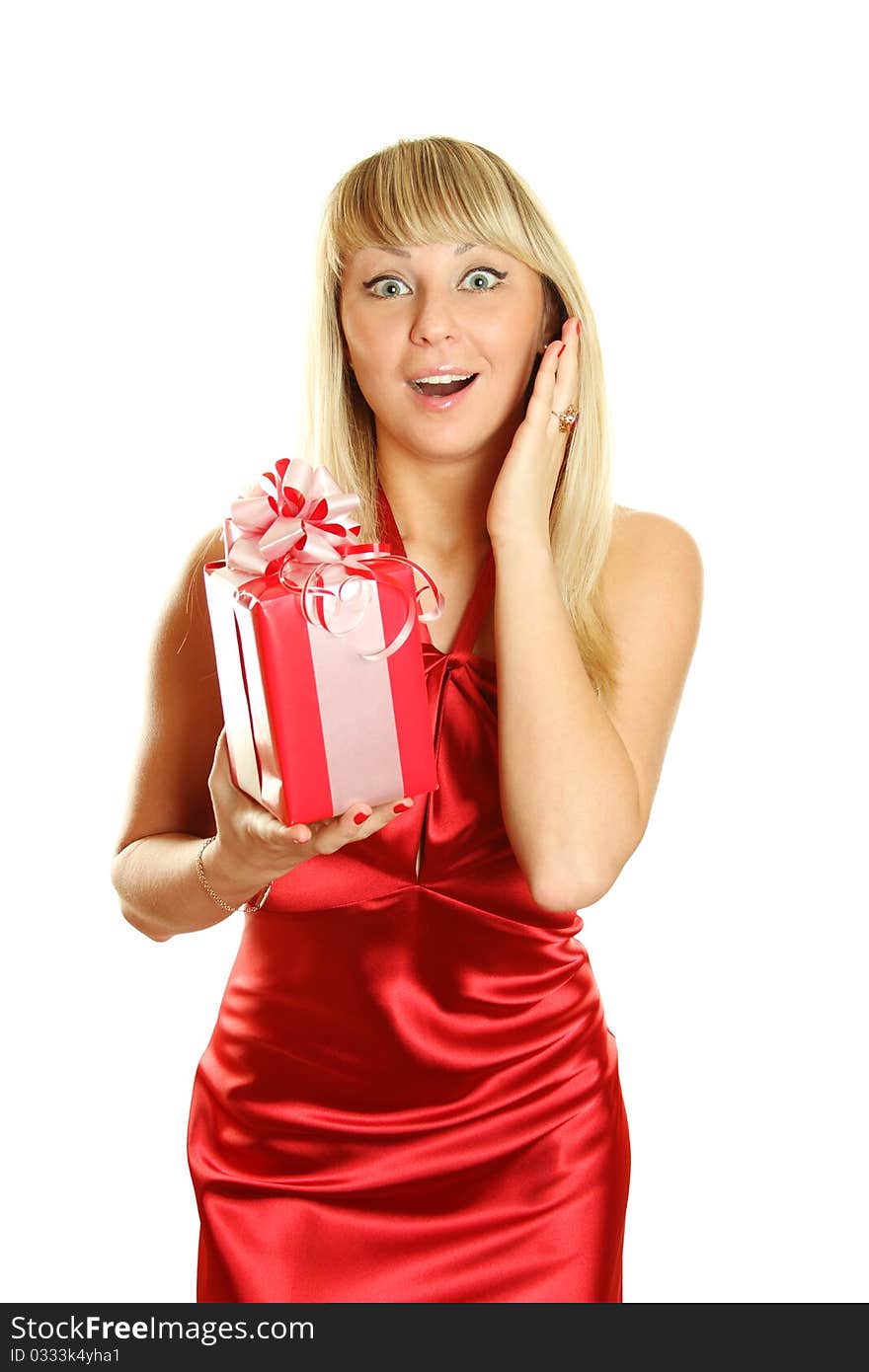 Beautiful girl in a red dress and hat of Santa with a big gift box. Surprised. Lots of copyspace and room for text on this isolate. Beautiful girl in a red dress and hat of Santa with a big gift box. Surprised. Lots of copyspace and room for text on this isolate