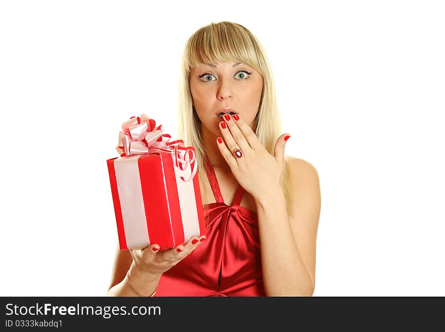 Beautiful girl in a red dress and hat of Santa with a big gift box. Surprised. Lots of copyspace and room for text on this isolate. Beautiful girl in a red dress and hat of Santa with a big gift box. Surprised. Lots of copyspace and room for text on this isolate