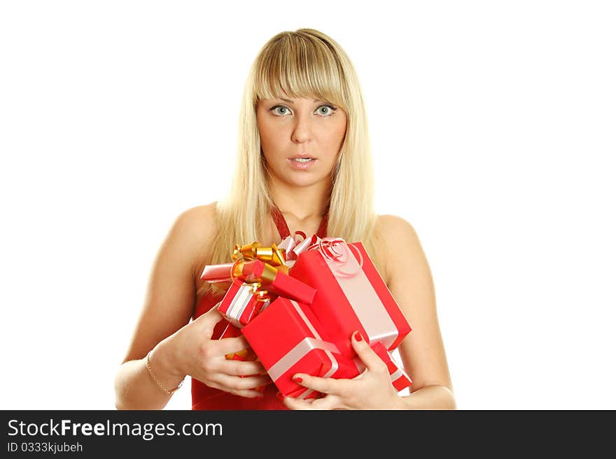 Beautiful girl in a red dress with lots of red gift boxes for Christmas. Surprised. Lots of copyspace and room for text on this isolate. Beautiful girl in a red dress with lots of red gift boxes for Christmas. Surprised. Lots of copyspace and room for text on this isolate