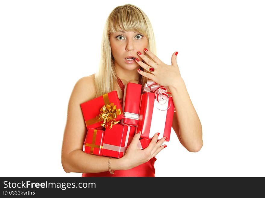 Beautiful girl in a red dress with lots of red gift boxes for Christmas. Surprised. Lots of copyspace and room for text on this isolate. Beautiful girl in a red dress with lots of red gift boxes for Christmas. Surprised. Lots of copyspace and room for text on this isolate