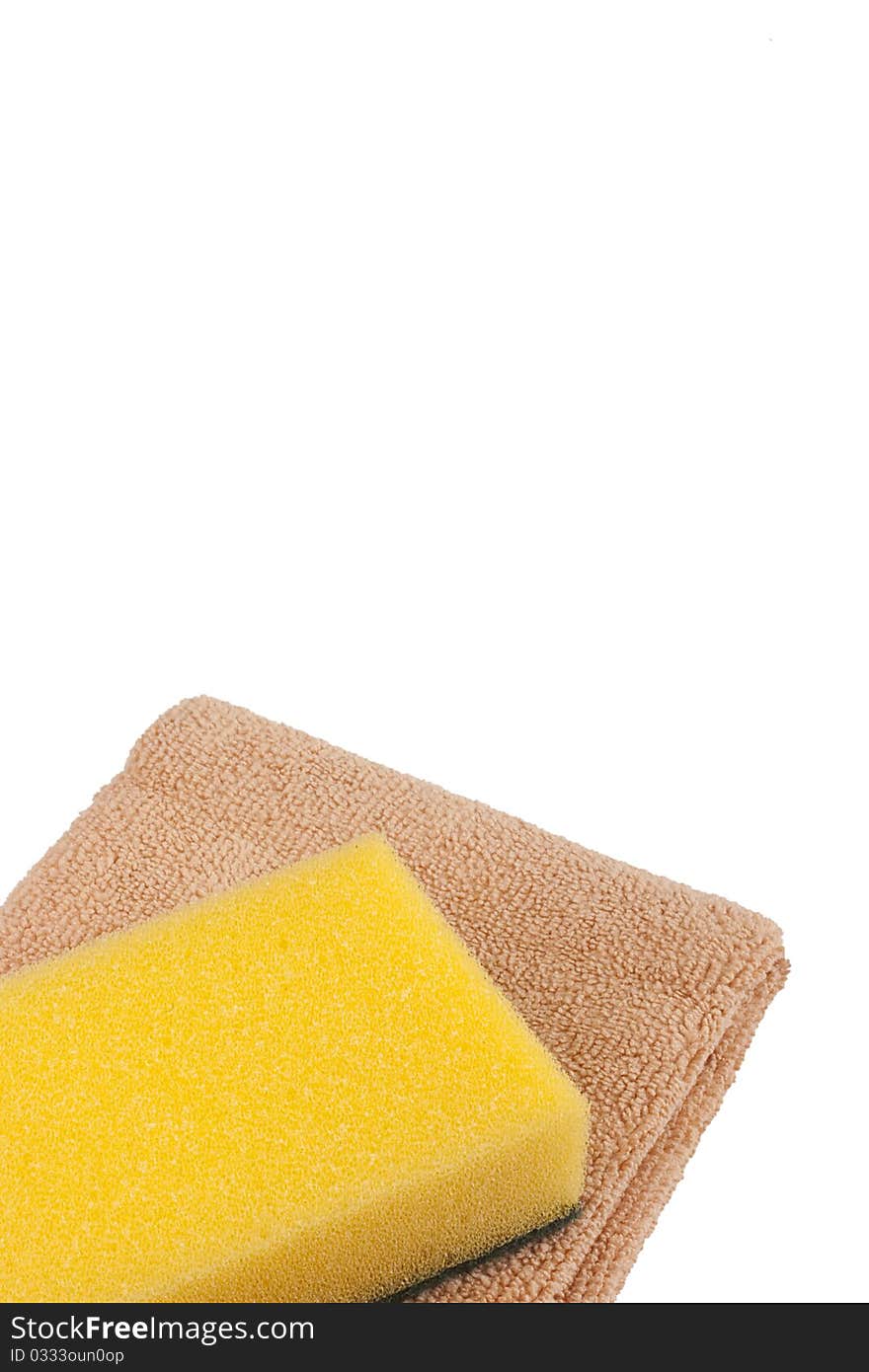 Pink cloth fabric with synthetic yellow sponge for cleaning the room.