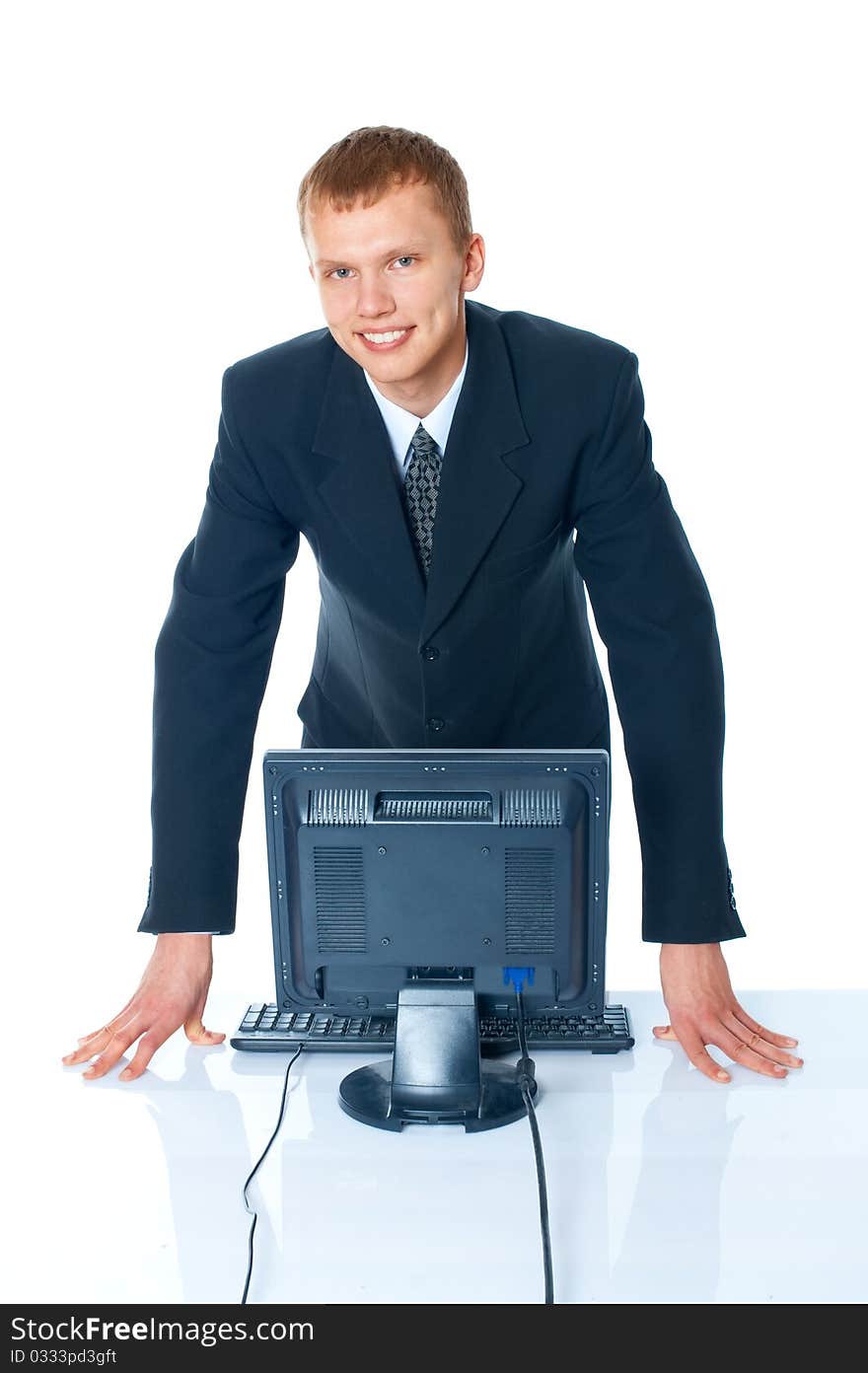 young man with a computer on a white background