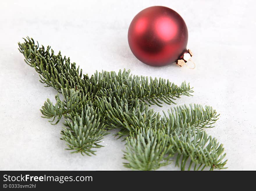 A fir tree branch with Christmas bauble. A fir tree branch with Christmas bauble