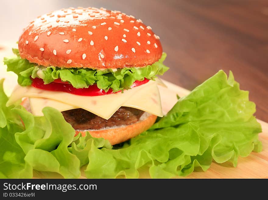 Appetizing cheeseburger. Isolated over white background. Appetizing cheeseburger. Isolated over white background.