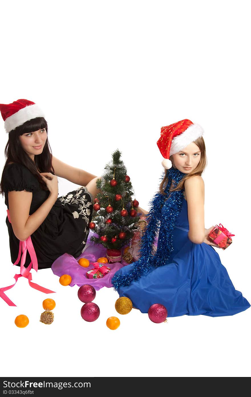 Two young beautiful woman with Christmas gifts.