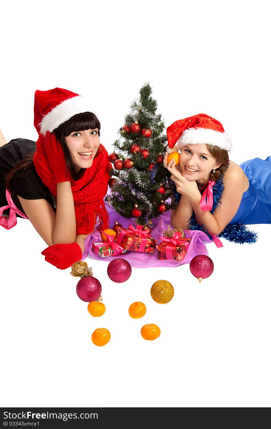 Two young beautiful woman with Christmas gifts.