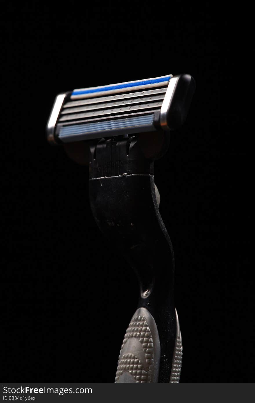 New razor isolated on black background.