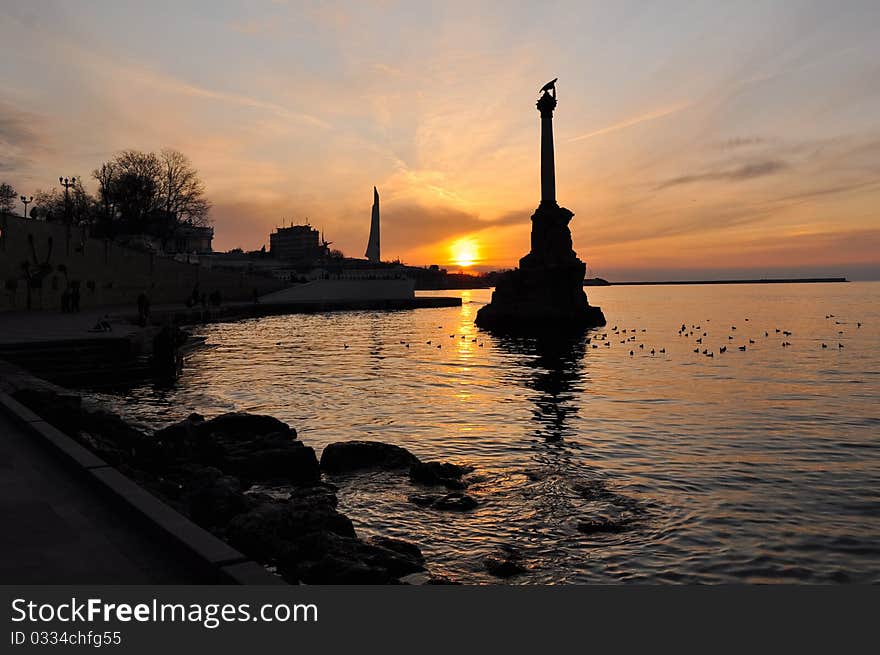 Evening promenade with a monument. Evening promenade with a monument