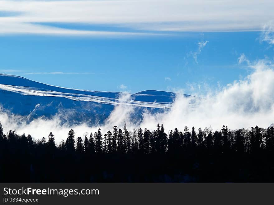 Winter landscape with clouds