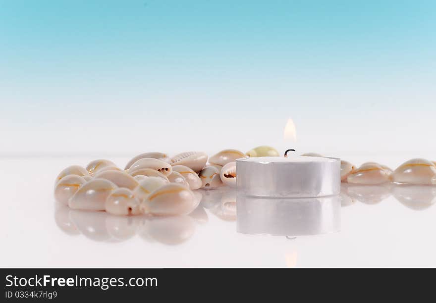 Peaceful Setting with Candle and Shells