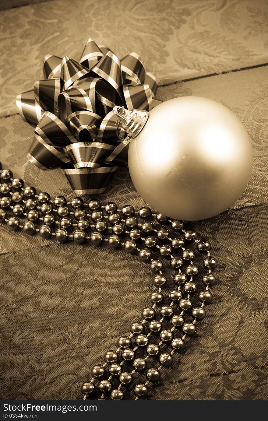 Joyful Holidays Conceptual Image With Ornament, Bow And Beads