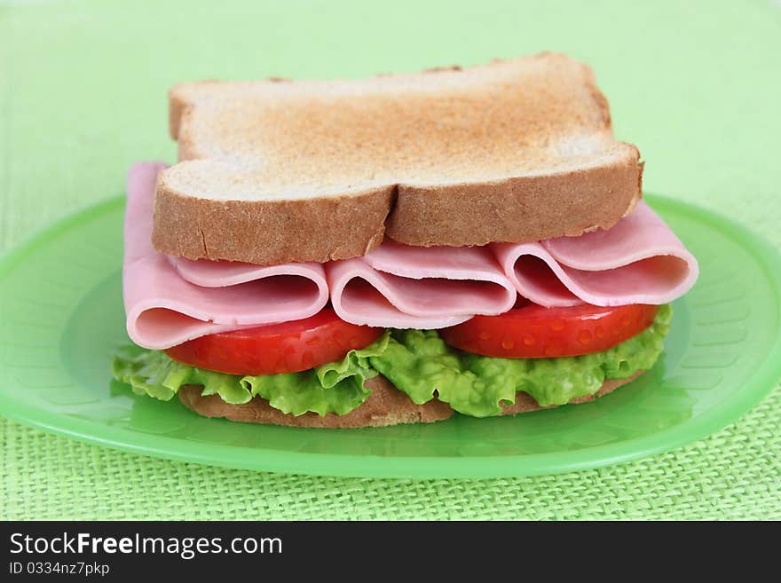 ham sandwich with tomato and lettuce