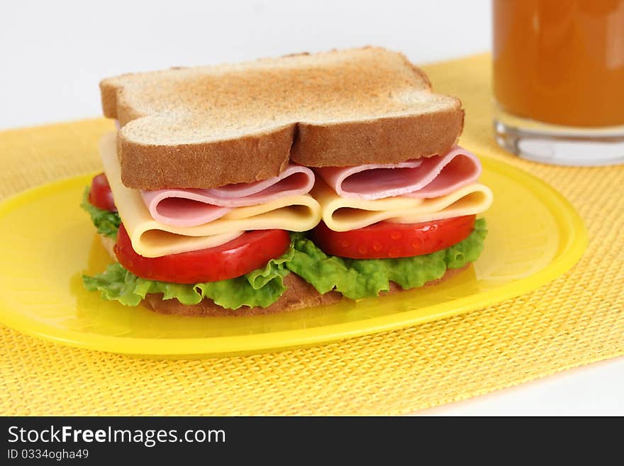 ham and cheese sandwich with lettuce and tomato