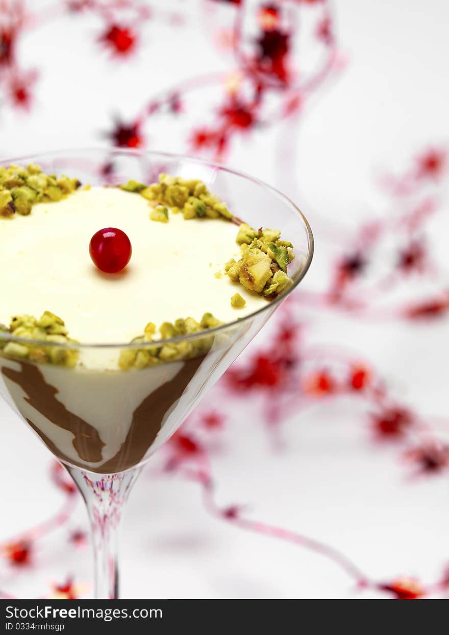 A bicolored pannacotta with a christmas garland