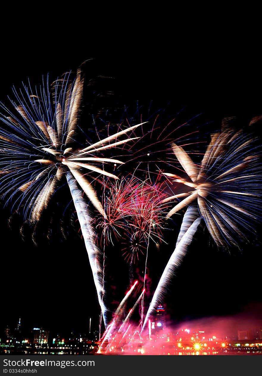 Beautiful and colorful fireworks by the Tamsui River over the sky at night. Lights, shadows and smoke with beautiful colors. Beautiful and colorful fireworks by the Tamsui River over the sky at night. Lights, shadows and smoke with beautiful colors.