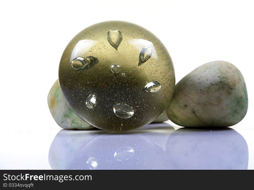 Glass paper weight with wwhite background.