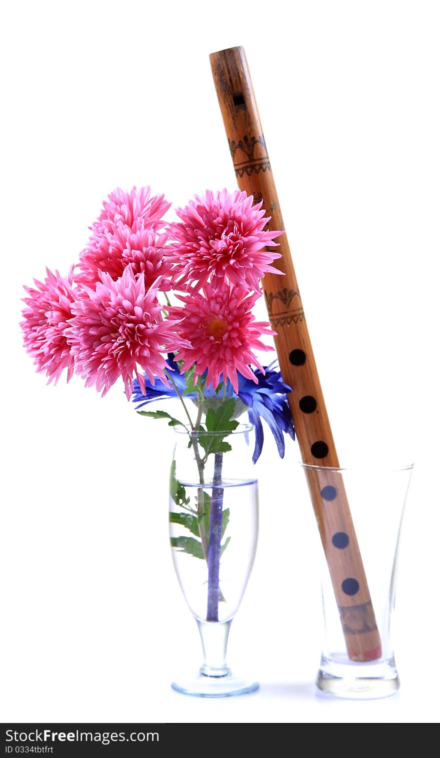 Concept pic of flowers and flute isolated on white background. Concept pic of flowers and flute isolated on white background.