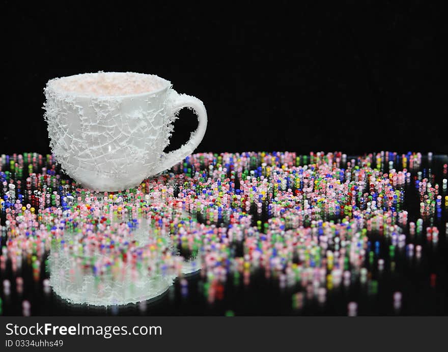 White coffee cup, covered with cold hoarfrost.