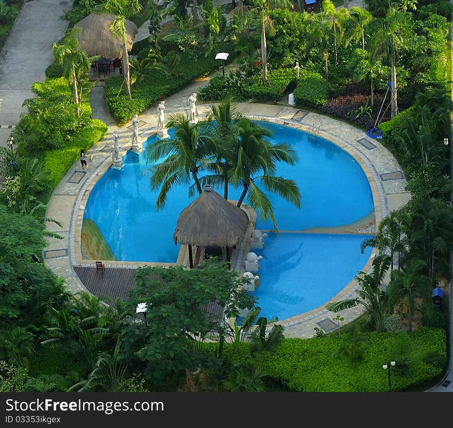 Luxurious covered patio with pool, and tropical flowers and trees. Luxurious covered patio with pool, and tropical flowers and trees