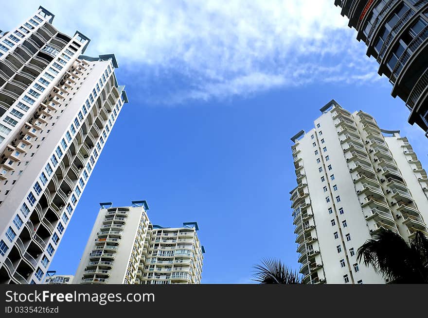 High-rise building in the blue sky, colorful, very tall and spectacular