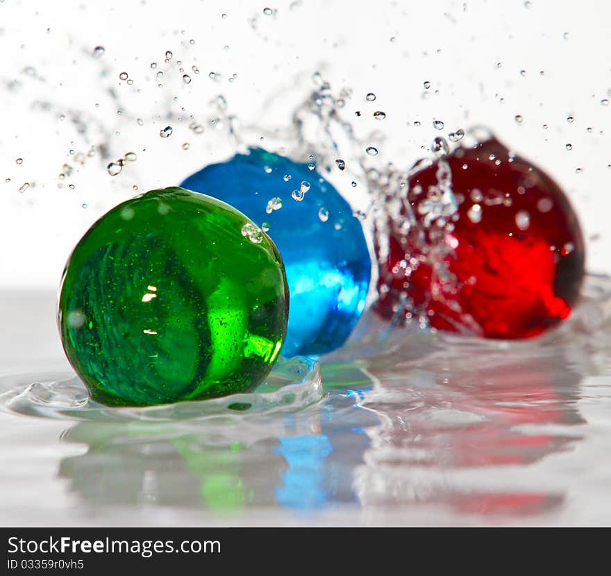 Water spheres frozen action on white background. Water spheres frozen action on white background